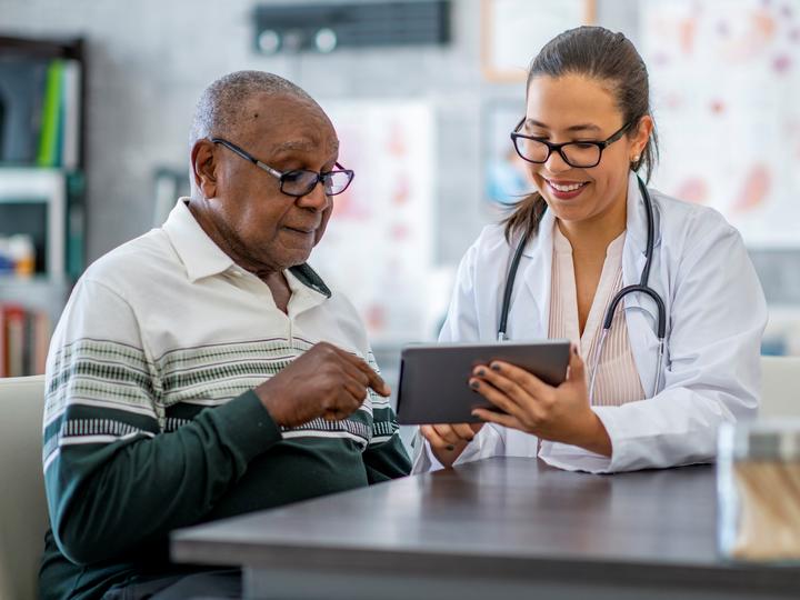 Elderly speaking with doctor