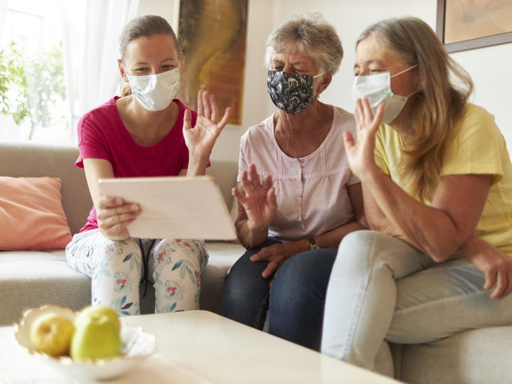 Three woman using iPad for video call